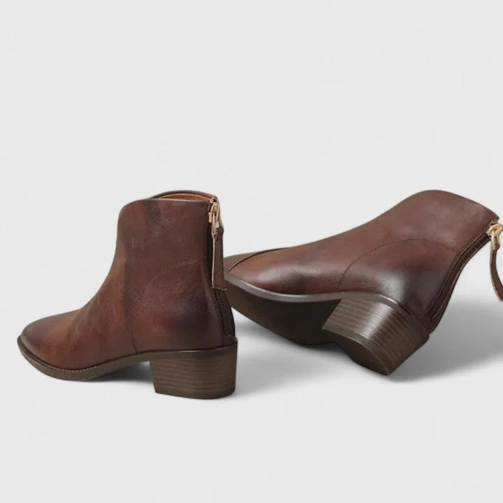 Women's faux leather side zip ankle boots with pointed toe and v-cut shaft