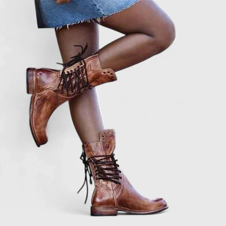 Women's faux leather lace-up combat boots with studded cuff