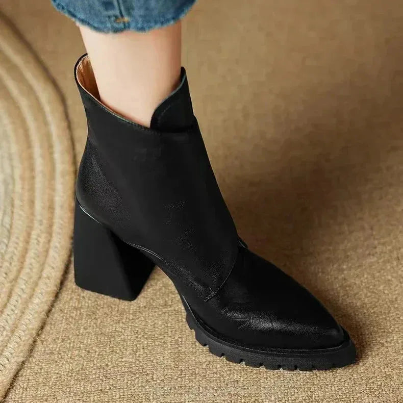 Women's faux leather ankle boots with metallic buckle detail