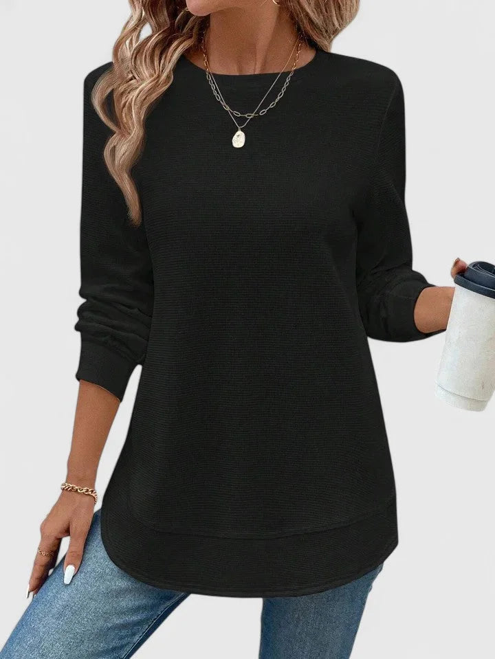 Women's knit crew neck sweater with curved hem