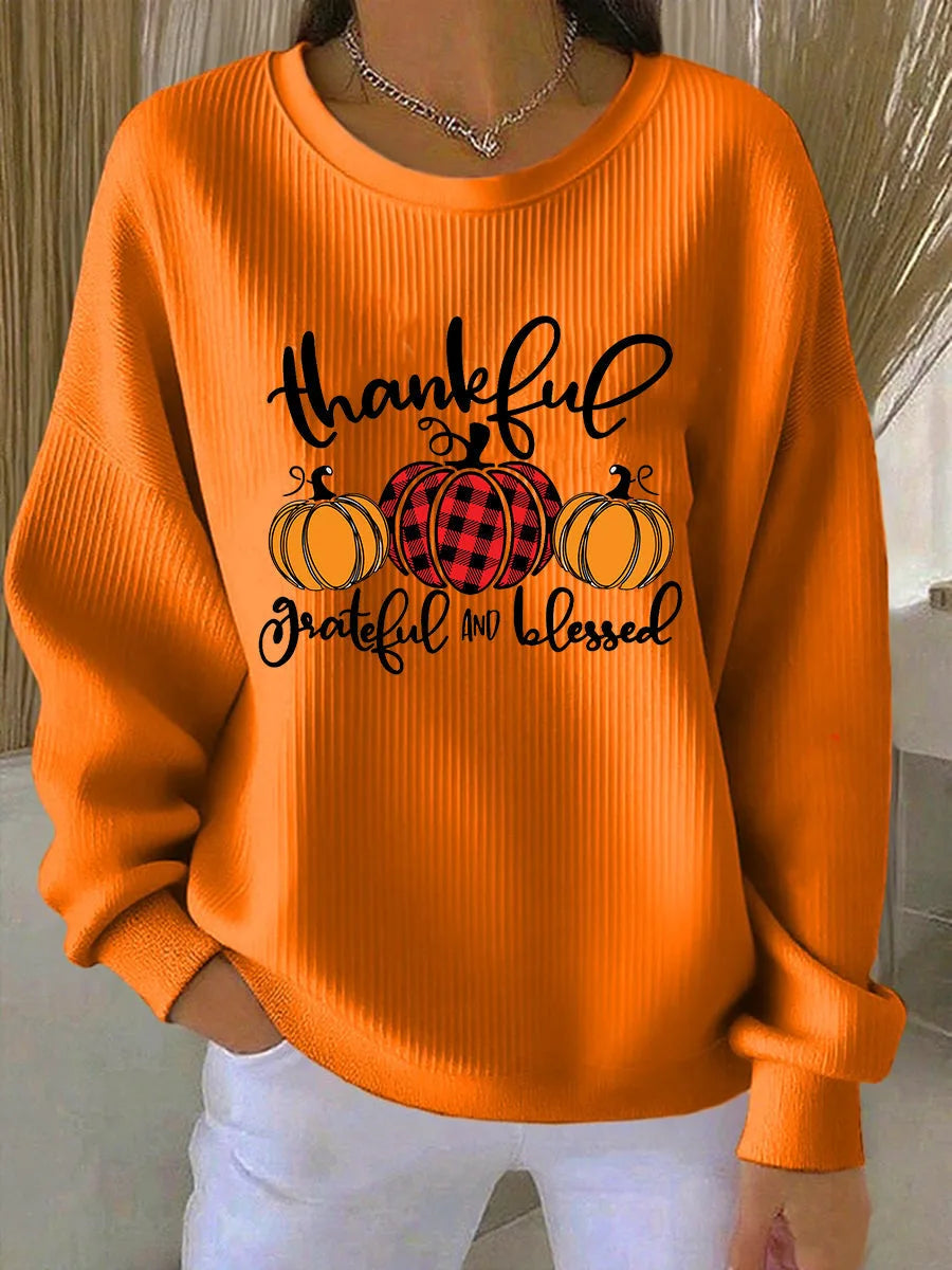Women's ribbed crew neck sweater with pumpkin graphic in orange