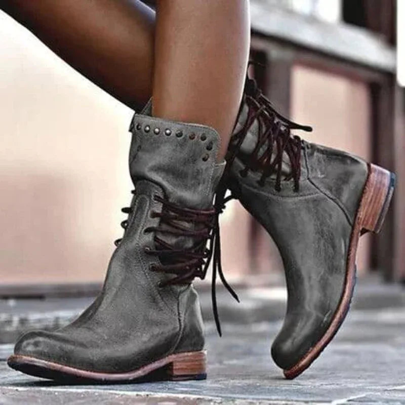 Women's faux leather lace-up ankle combat boots with studded cuff