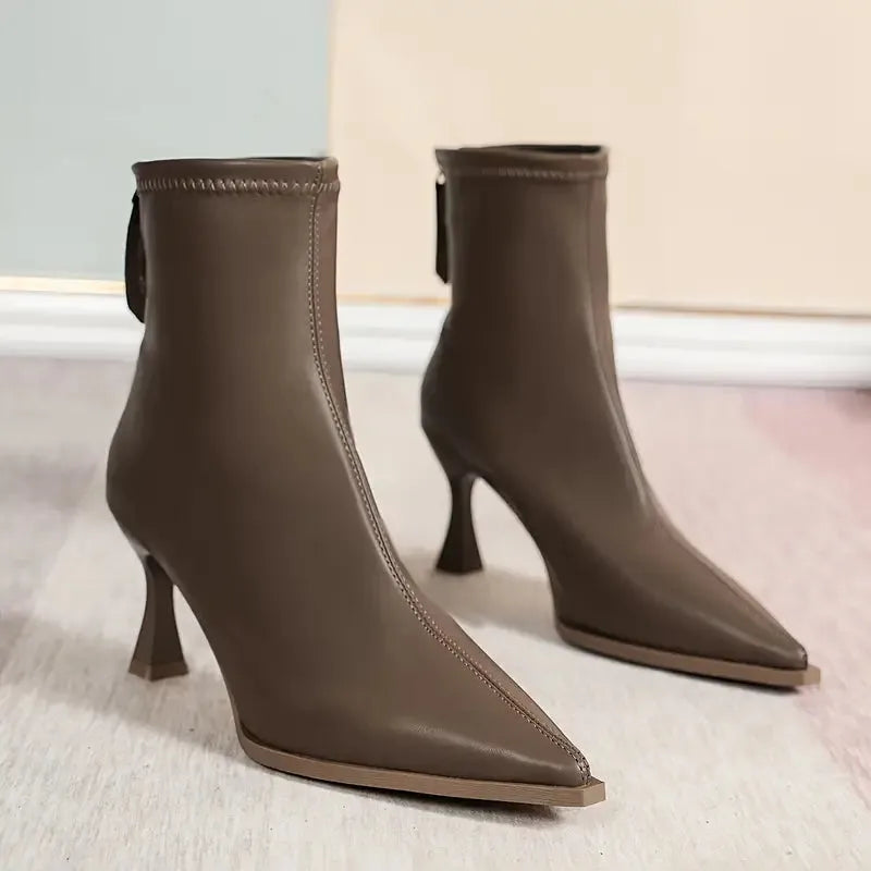 Women's faux leather side zip ankle boots with 'uim' lettering