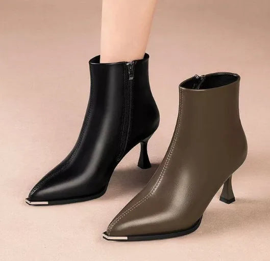 Women's faux leather side zip ankle boots with 'uim' lettering