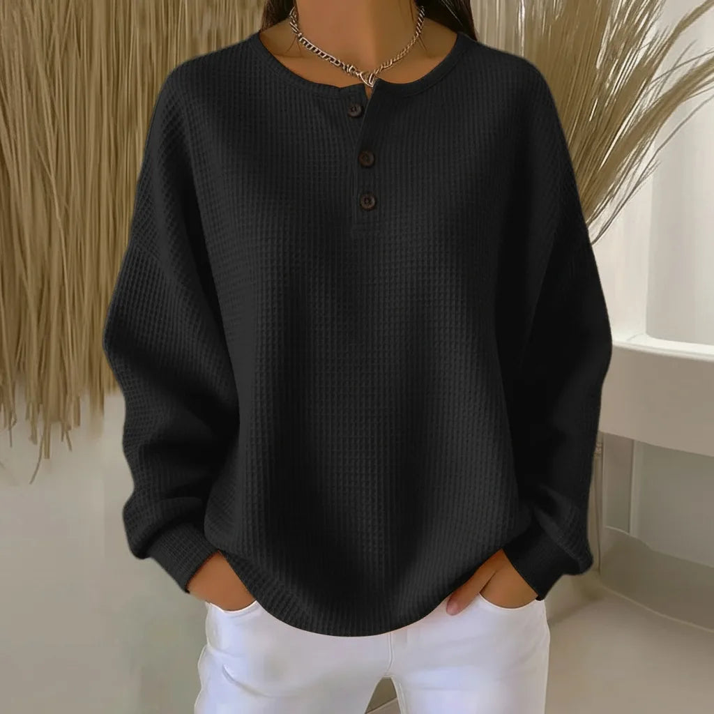 Women's knit crew neck sweater with button placket