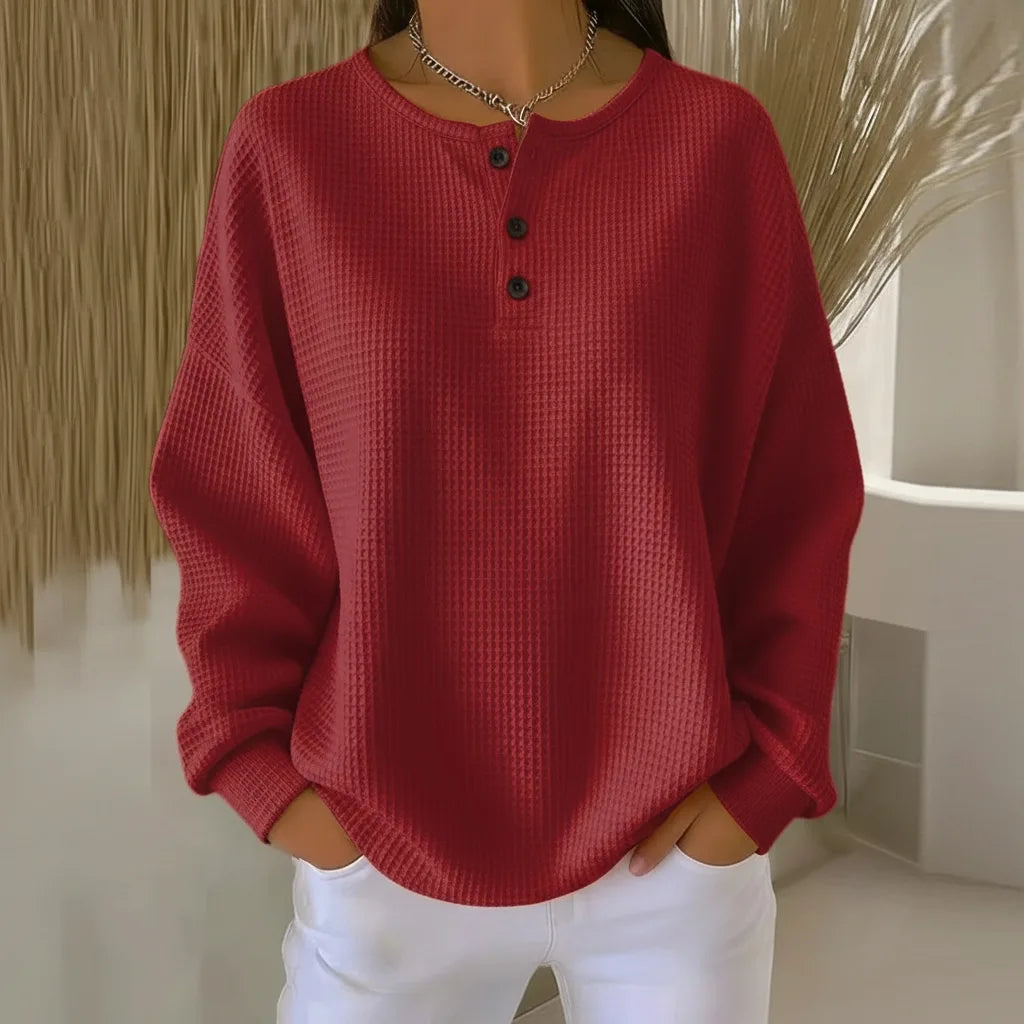 Women's knit crew neck sweater with button placket