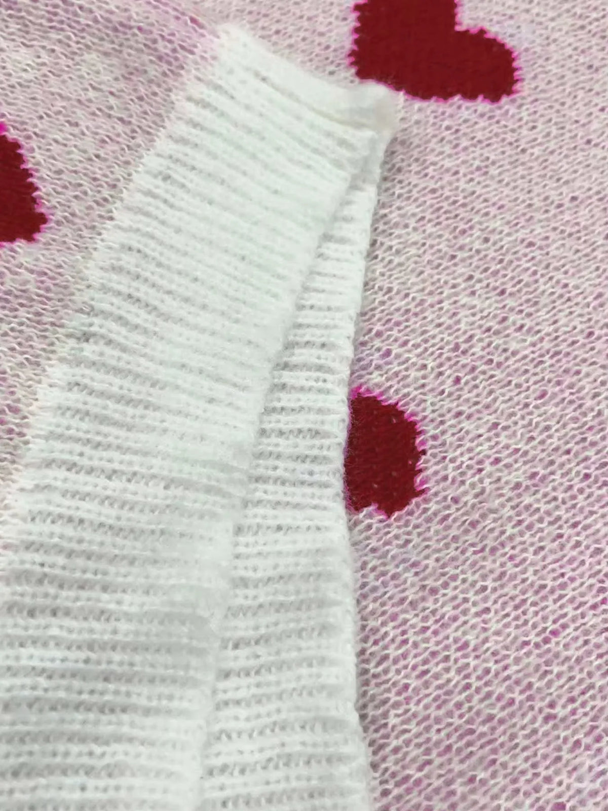 Women's knit crew neck sweater with heart pattern