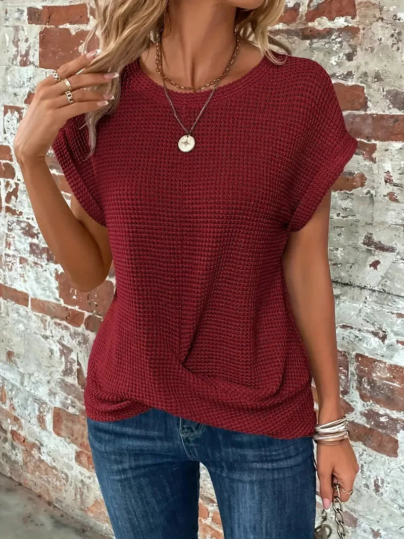 Women's knit crew neck sweater with twisted front hem