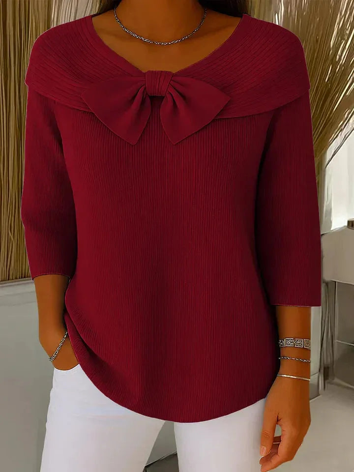 Women's ribbed v-neck sweater with large bow detail