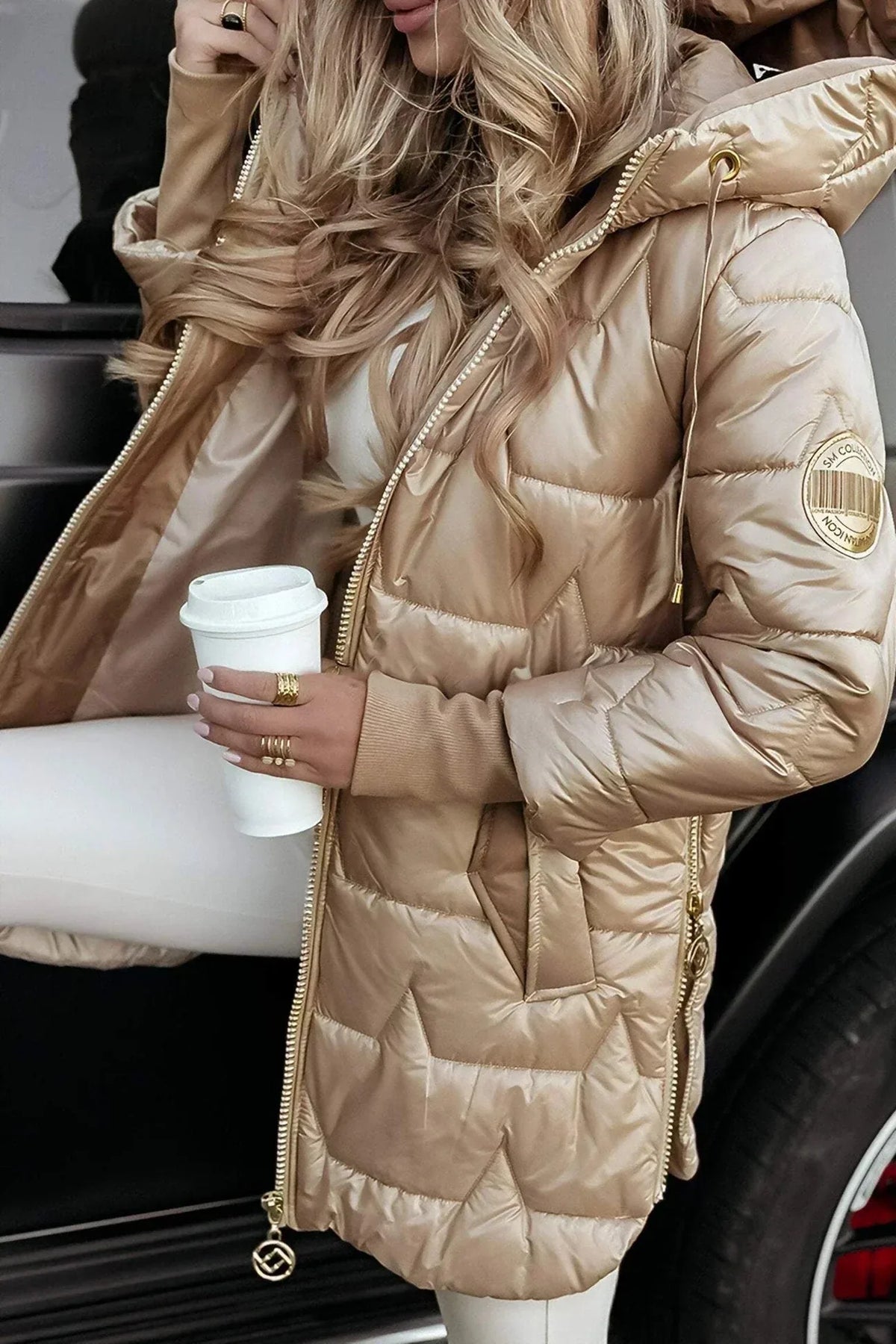 Women's zip-up hooded quilted coat with ribbed cuffs