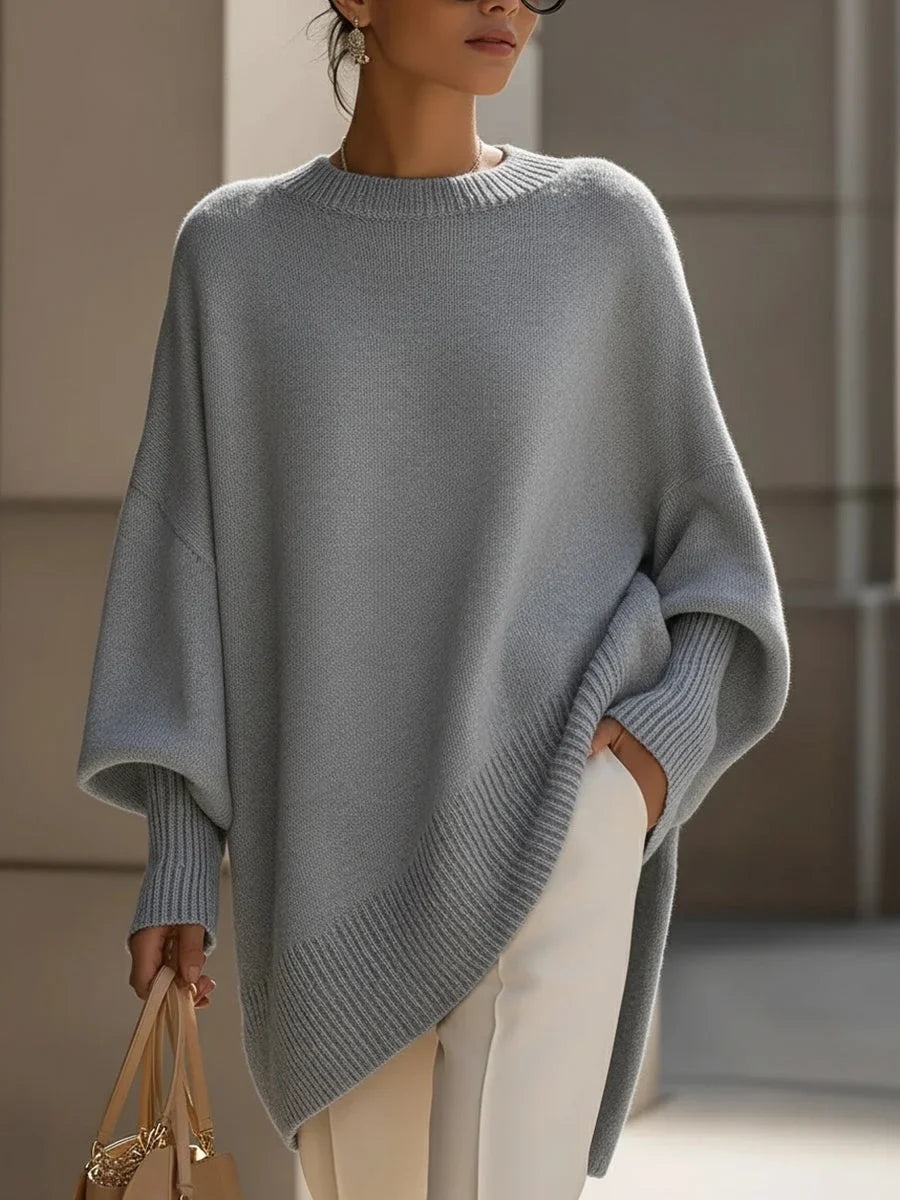 Women's knit crew neck sweater with asymmetrical hem