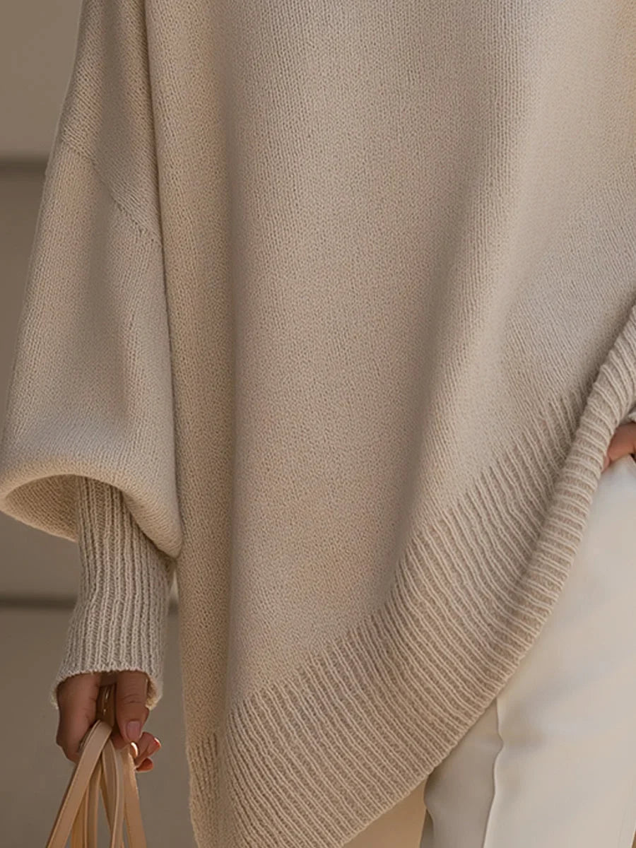 Women's knit crew neck sweater with asymmetrical hem