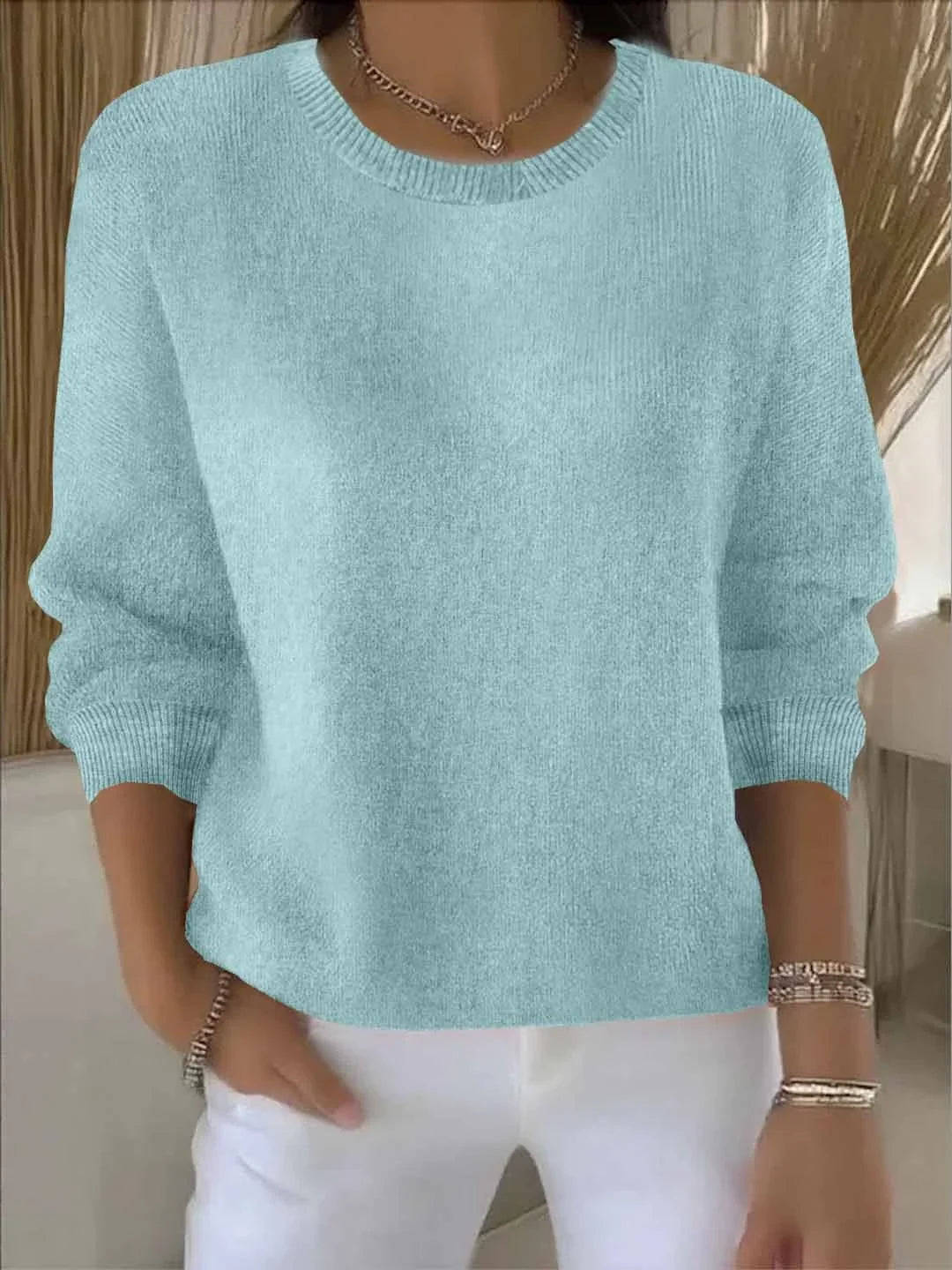 Women's knit crew neck sweater with ribbed cuffs and hem