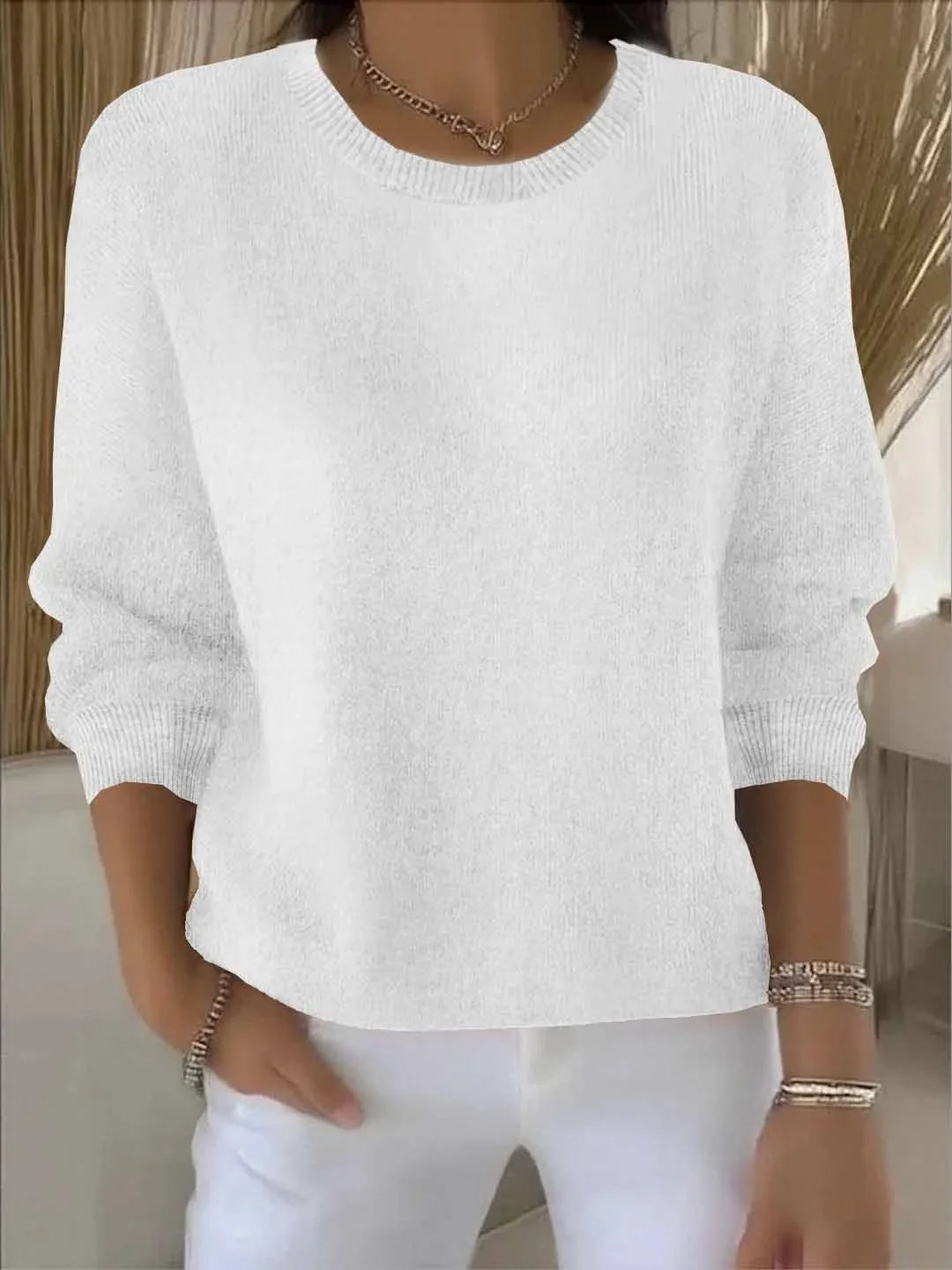 Women's knit crew neck sweater with ribbed cuffs and hem