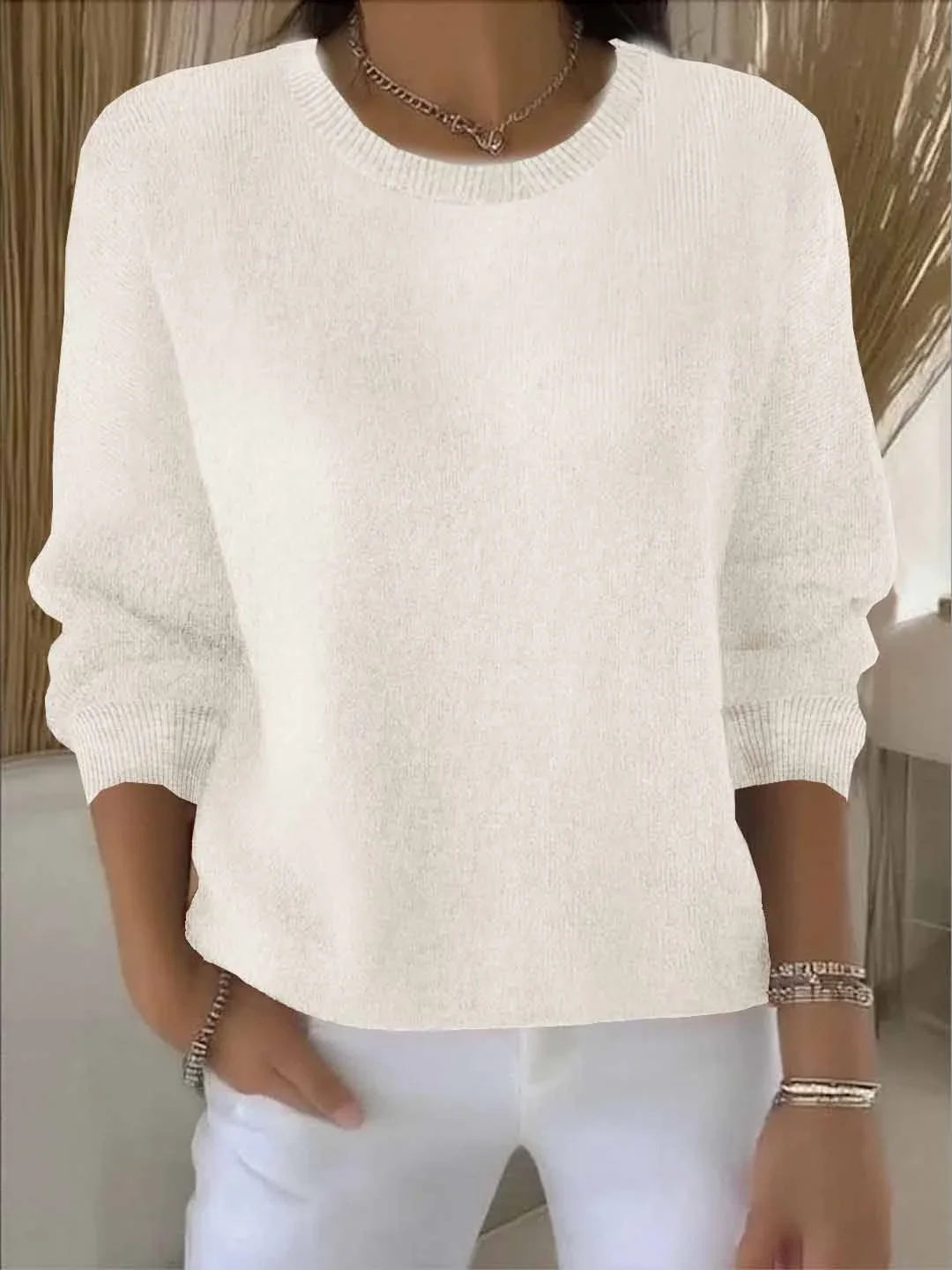 Women's knit crew neck sweater with ribbed cuffs and hem